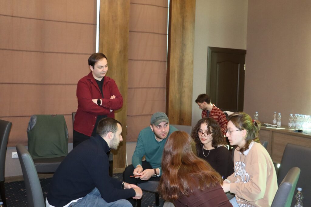 Irakli Tevzadze – trainer and youth worker, delivering a session with young people / a training group.